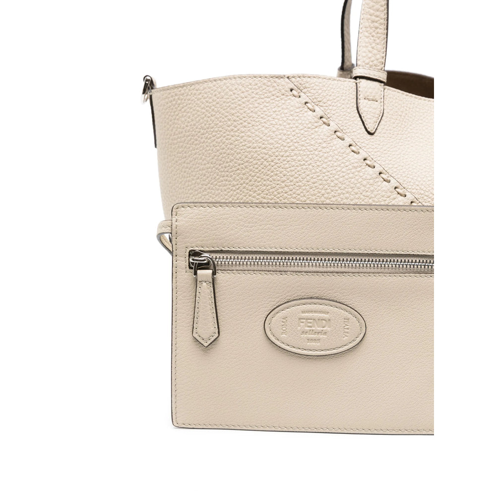 FENDI quarter view logo view of beige bag
