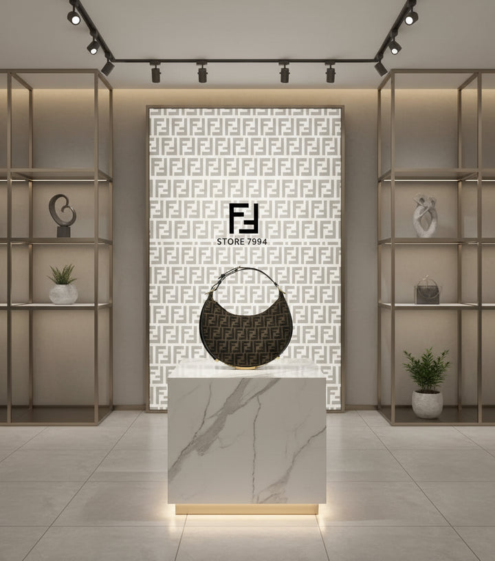 Designer handbag with monogram pattern on a white background