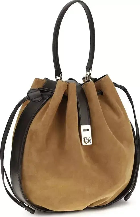 Tan handbag with black straps on a white background