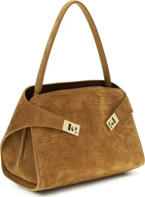 Brown textured handbag with a visible brand logo on a white background