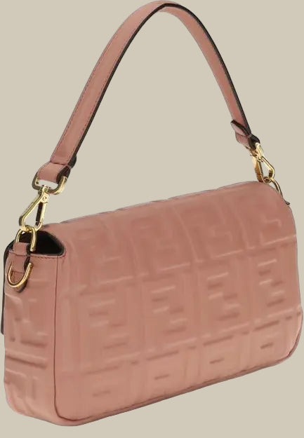 Pink handbag with gold hardware on a white background