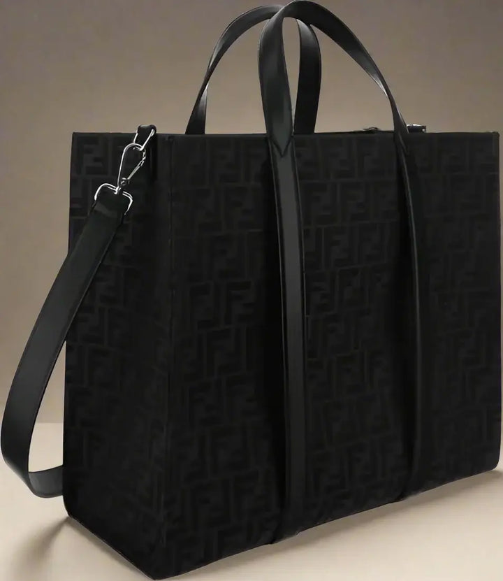Black tote bag with a pattern on a white background