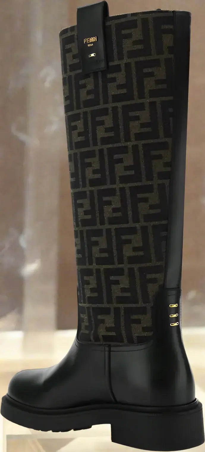 Black knee-high boot with patterned design on a black background