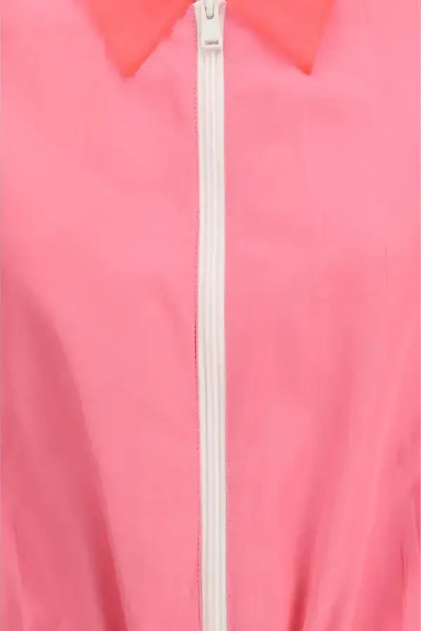 Close-up of a pink jacket with a white zipper