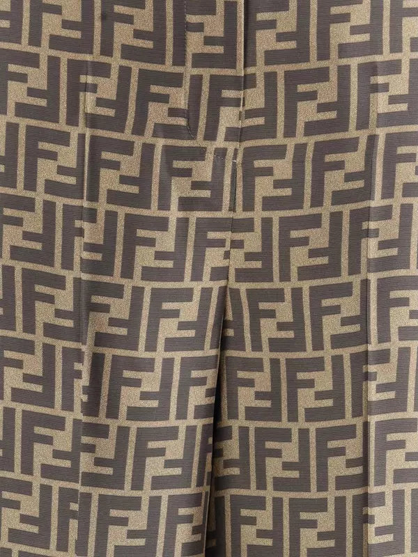 Close-up of fabric with a monogram pattern on a beige background