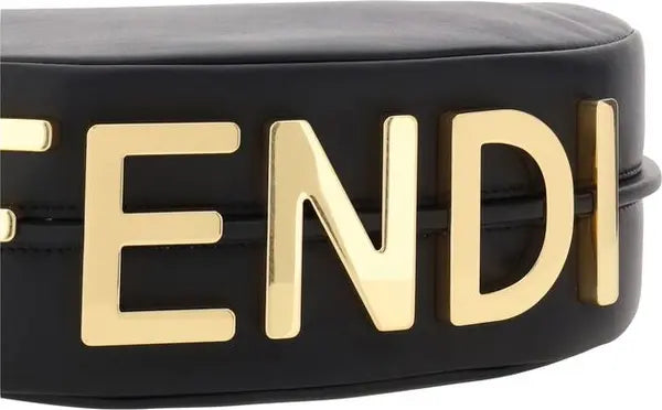Black belt with gold 'FENDI' letters on a black background