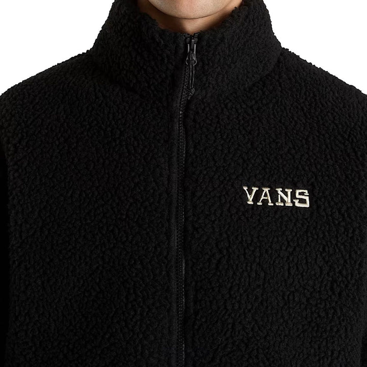Black fleece jacket with Vans logo on a white background