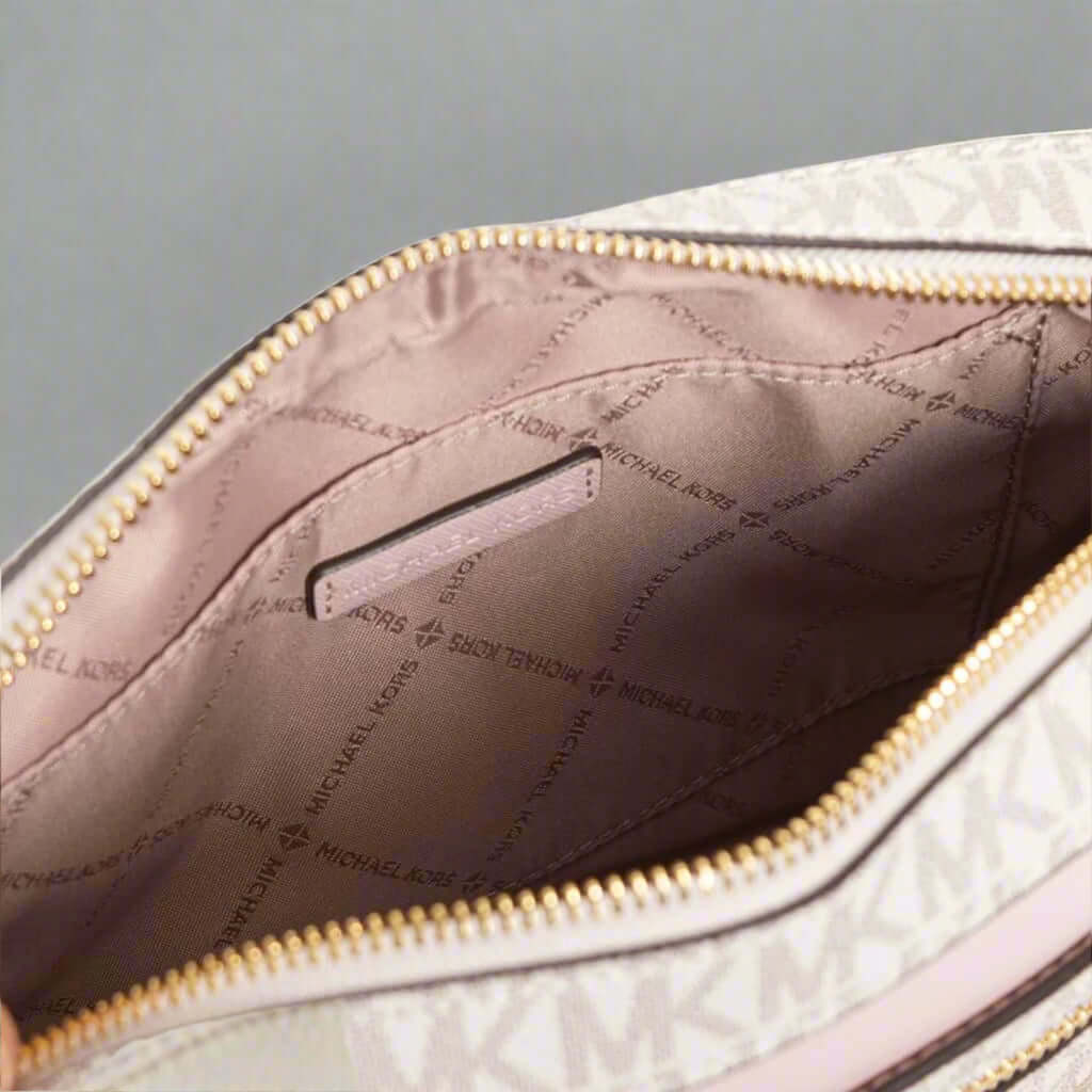 Close-up of a quilted handbag with visible branding inside.