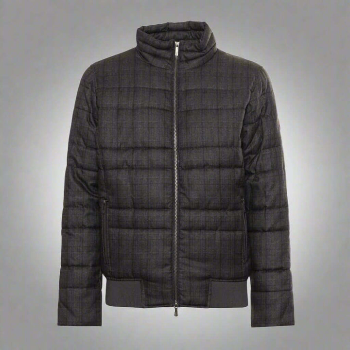 Black quilted jacket on a white background