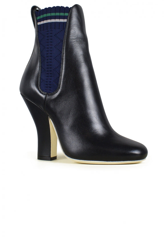 Black ankle boot with a high heel on a white background