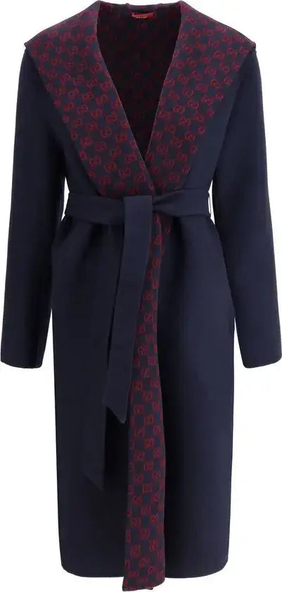 Navy blue coat with red patterned lining on a white background