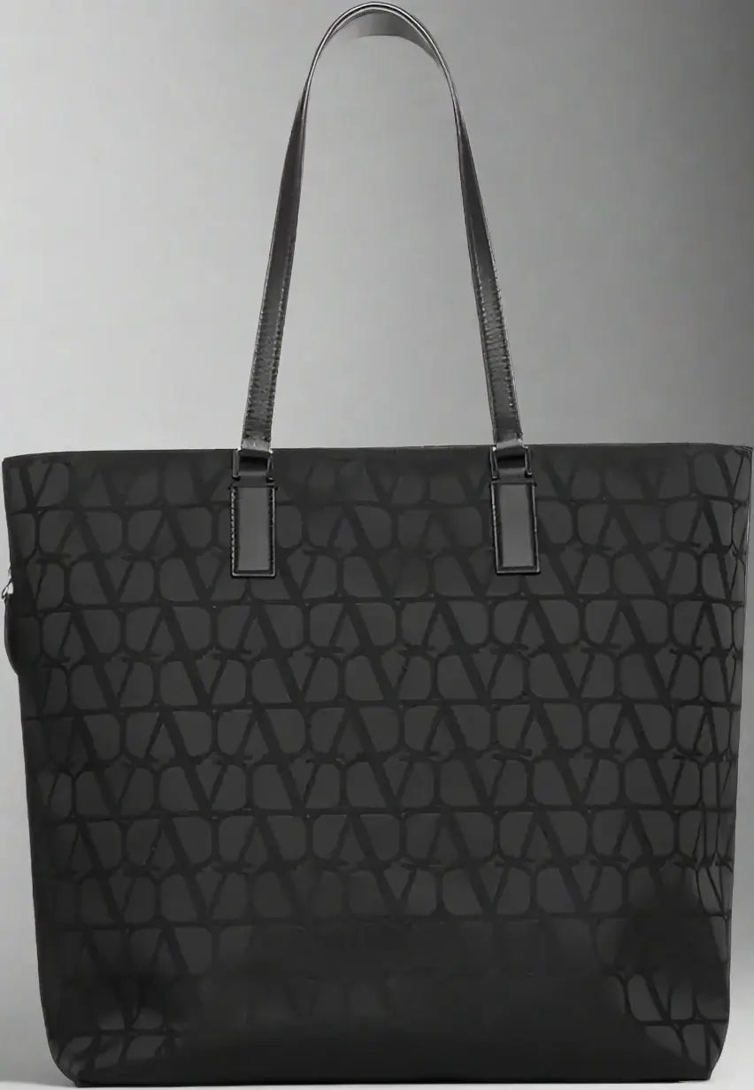 Black quilted tote bag on a white background