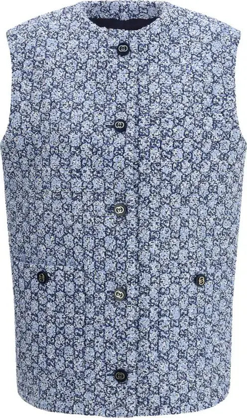Floral patterned vest with buttons on a plain background