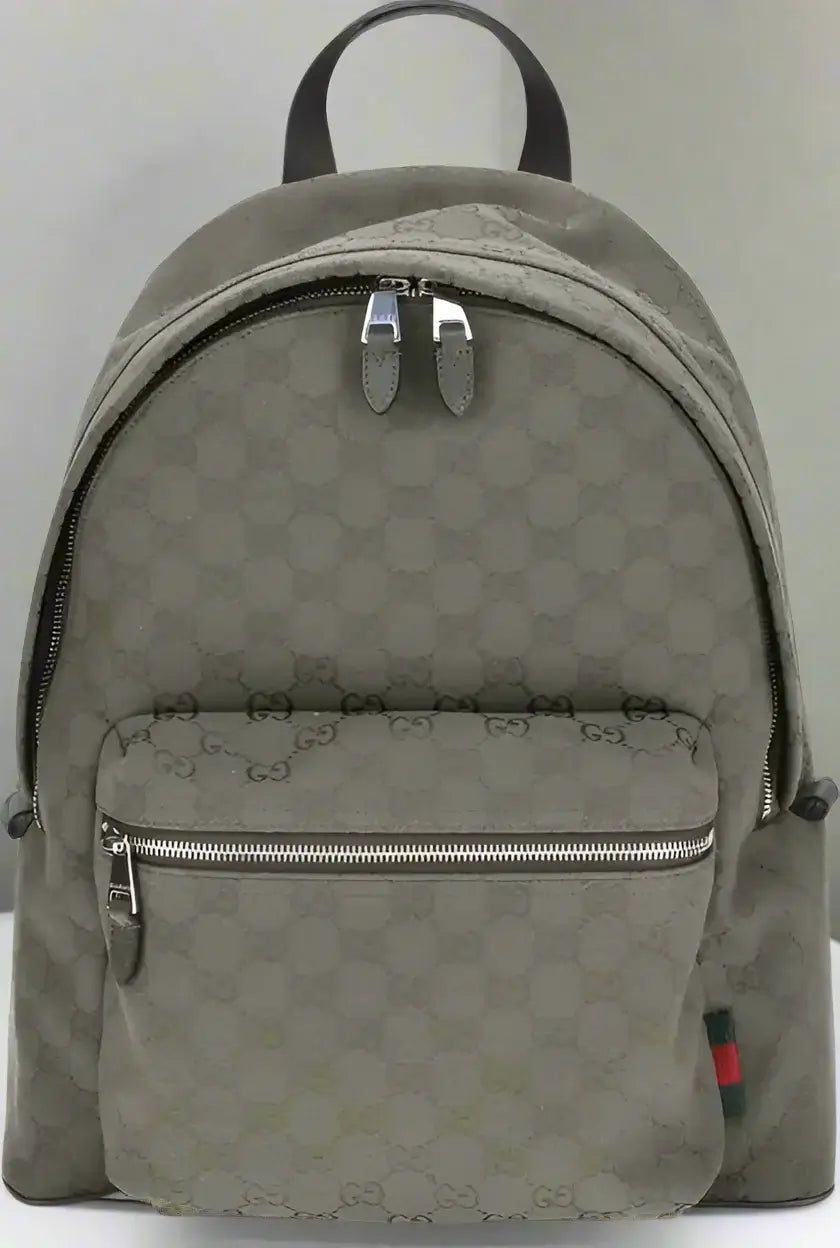 Green backpack with a pattern on a white background
