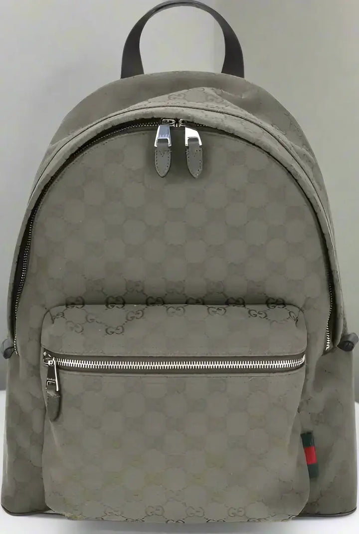 Green backpack with a pattern on a white background