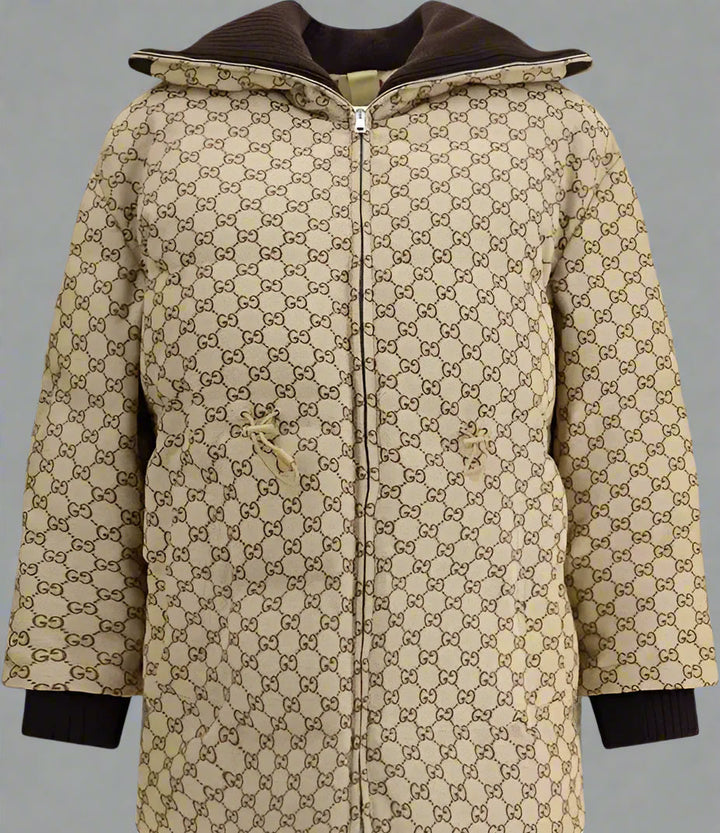 Beige coat with brown accents and a pattern on a white background