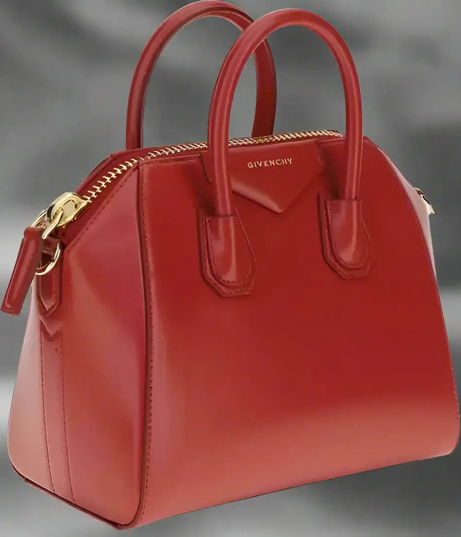 Red Givenchy handbag on a white background
