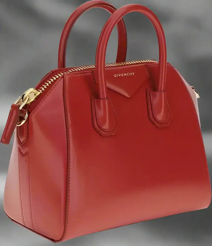 Red Givenchy handbag on a white background