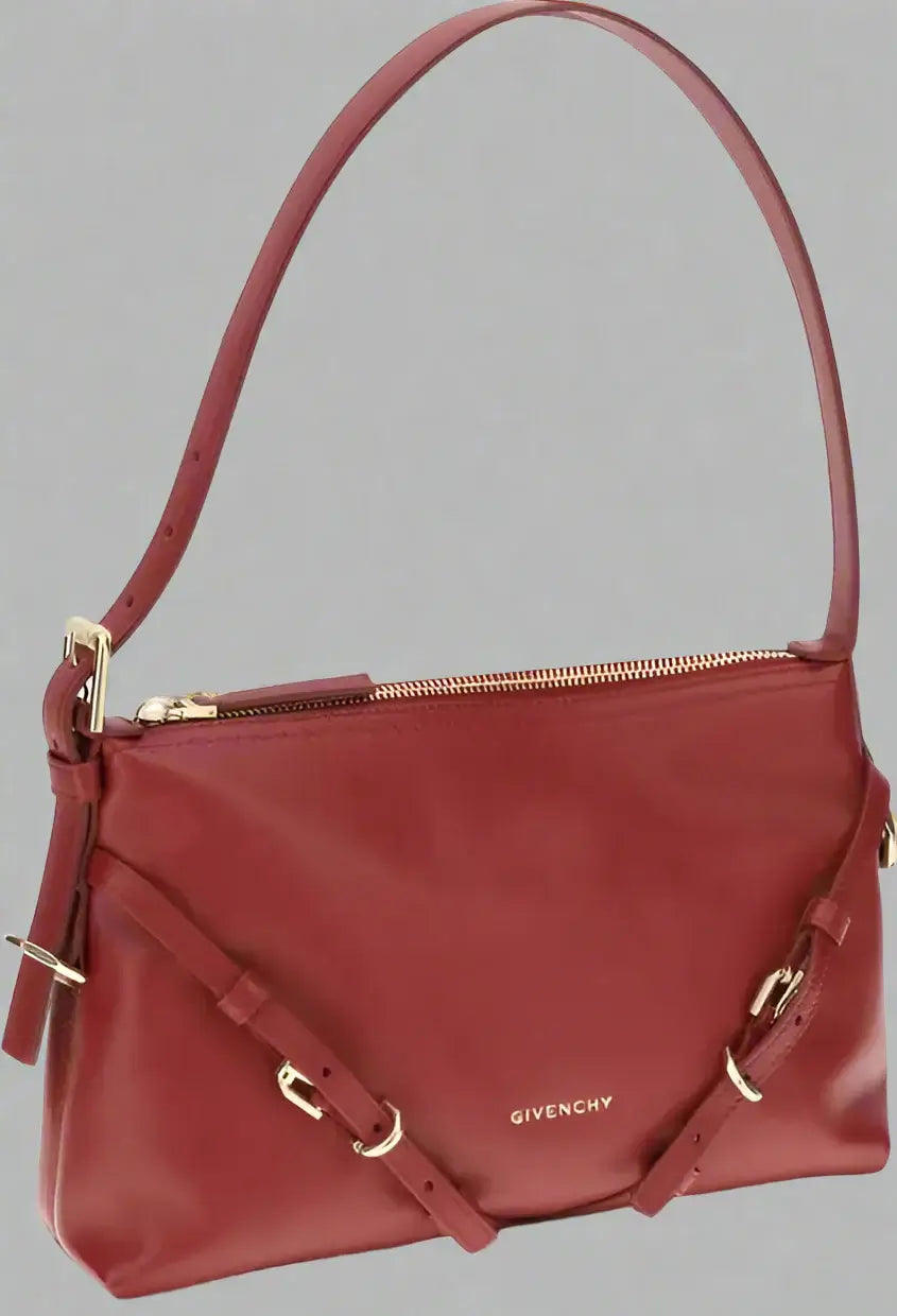 Red handbag with gold accents on a white background