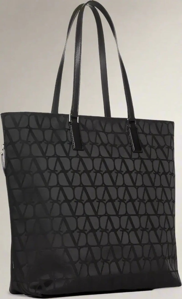 Black quilted tote bag on a white background
