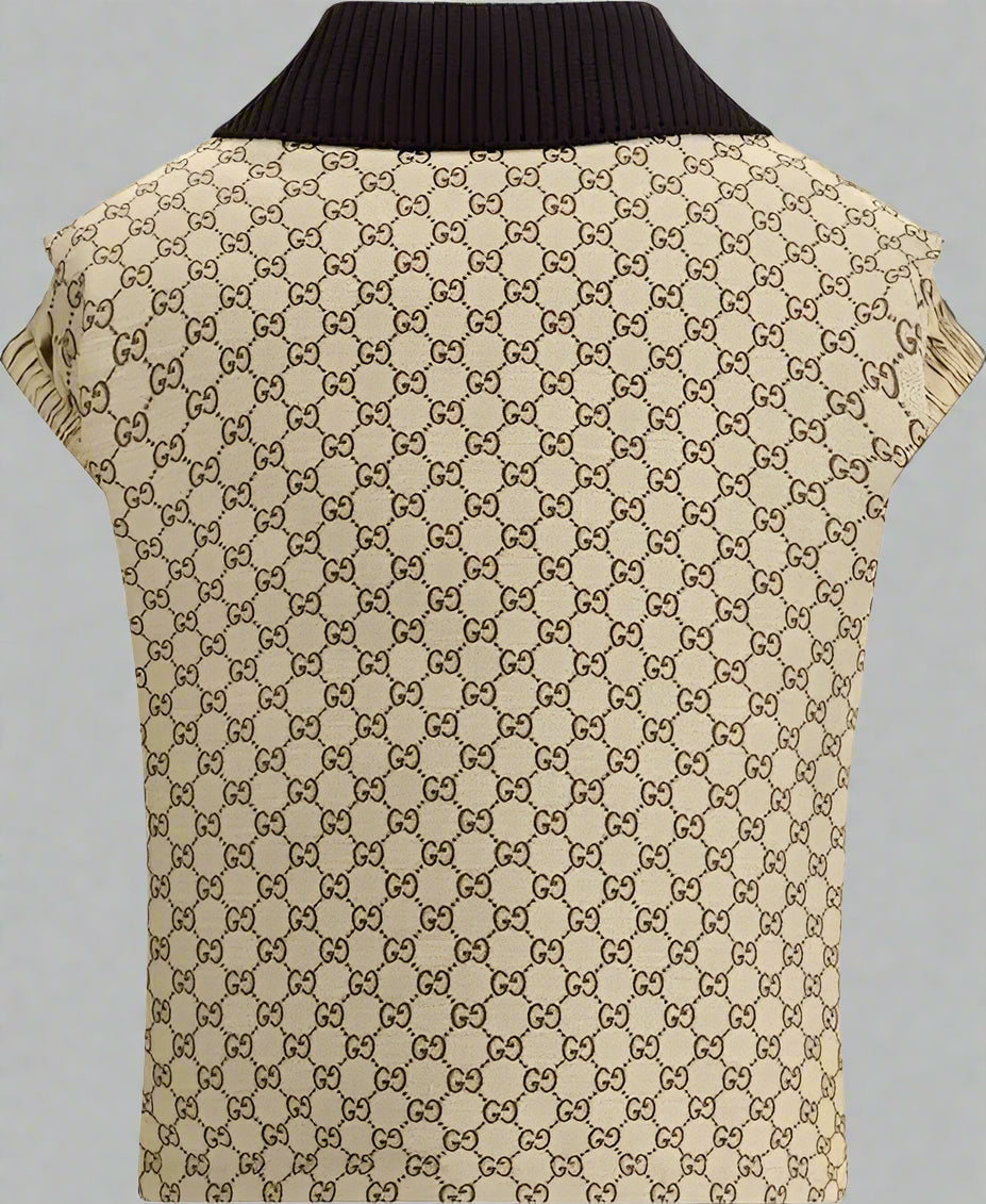 Beige patterned vest with black collar on a white background