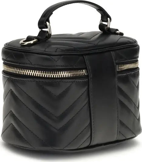Black quilted cosmetic bag with gold zipper on a white background