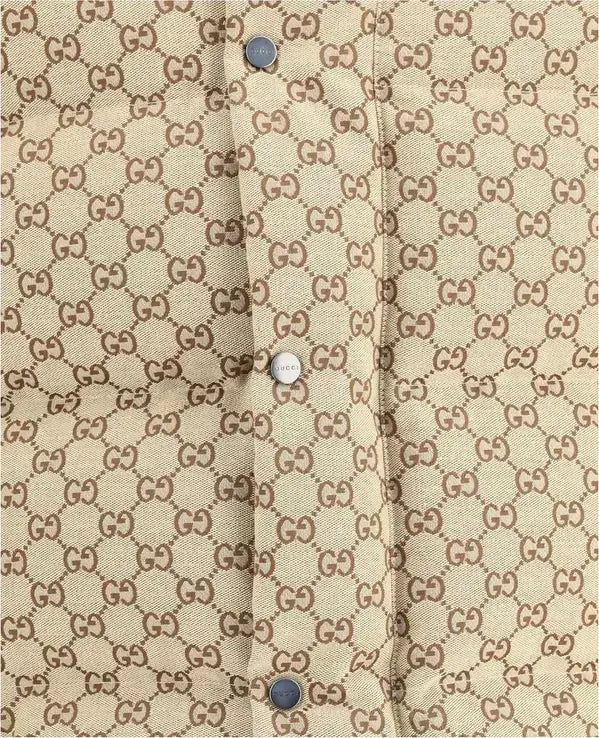 Close-up of a beige fabric with a pattern and buttons