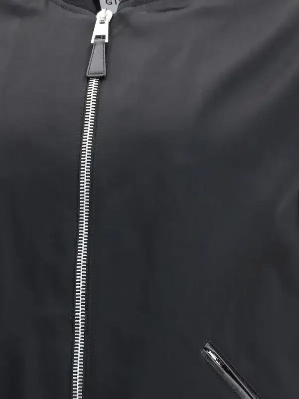 Close-up of a black jacket with a zipper