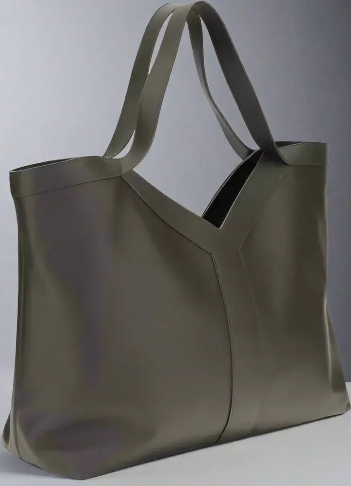 Grey leather tote bag on a white background