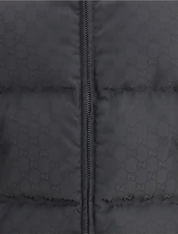 Dark gray puffer jacket with a patterned design and zipper