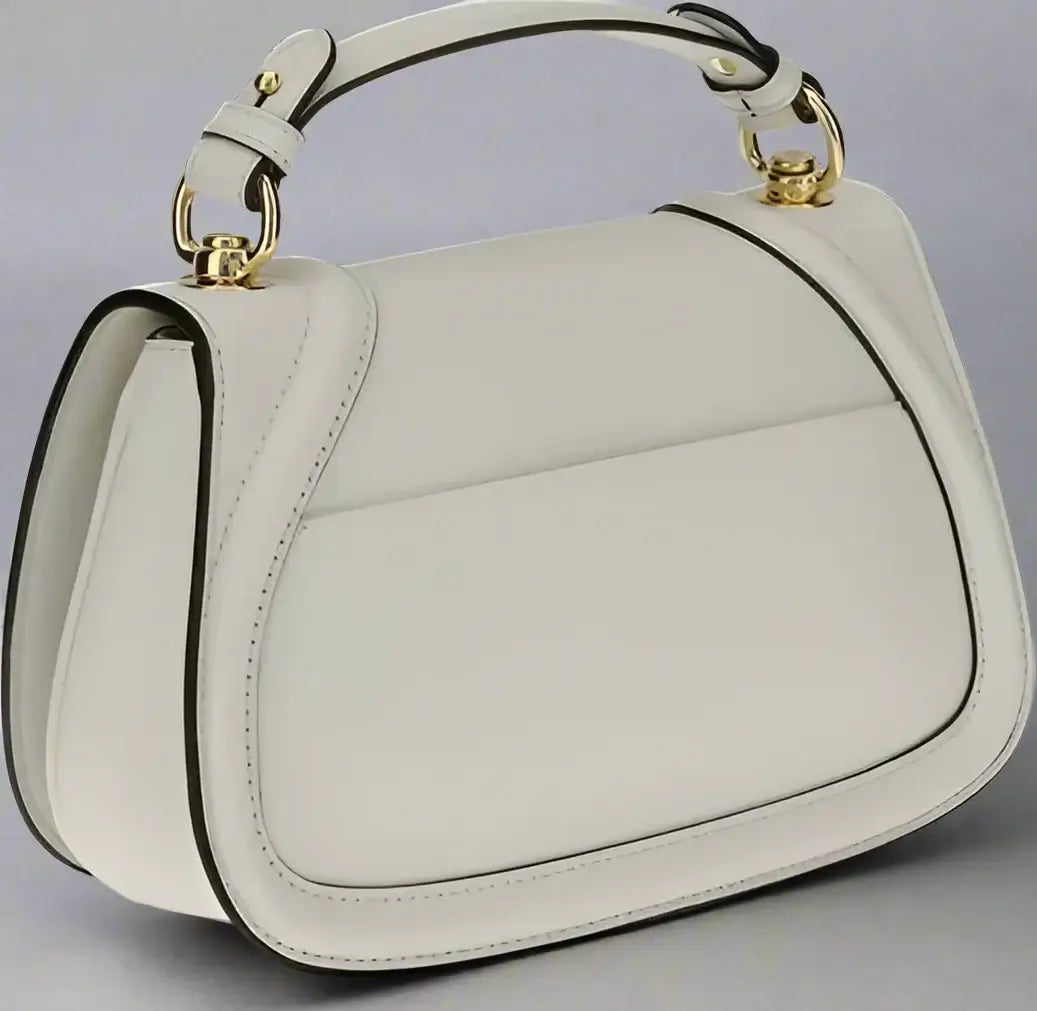 White handbag with gold accents on a white background