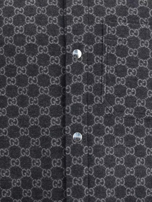 Dark gray fabric with a pattern of interlocking 'G' logos and silver buttons.