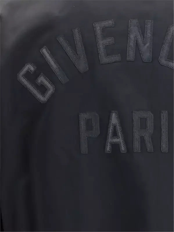 Black Givenchy Paris logo on a black background