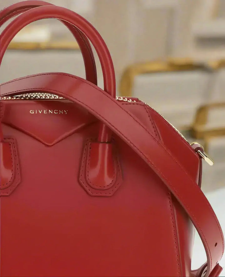 Red Givenchy handbag on a white background