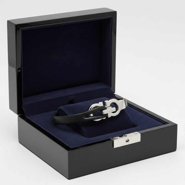 Black leather bracelet with silver clasp on a white background