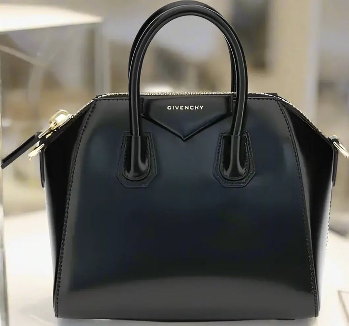 Black Givenchy handbag on a white background
