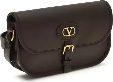 Brown leather bag with gold hardware on a white background