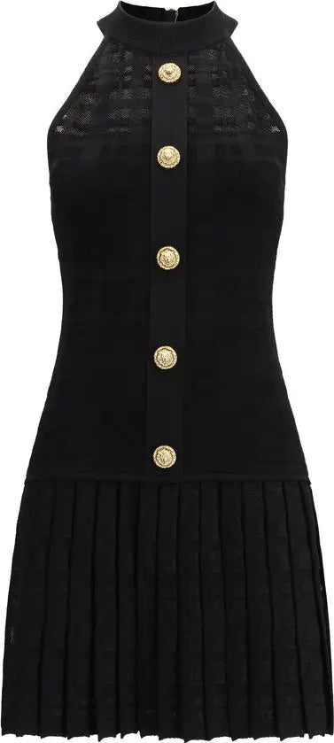 Black sleeveless dress with gold buttons on a white background