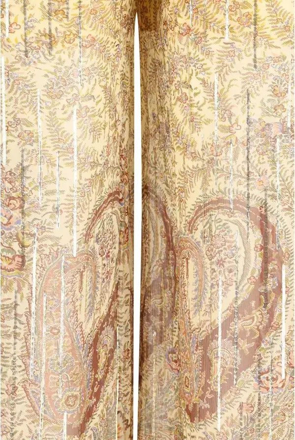 Pair of patterned pants with a decorative design on a plain background