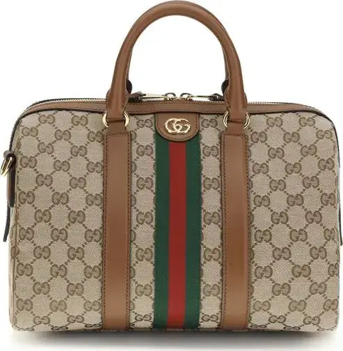 Designer handbag with patterned surface and visible brand logo on a white background
