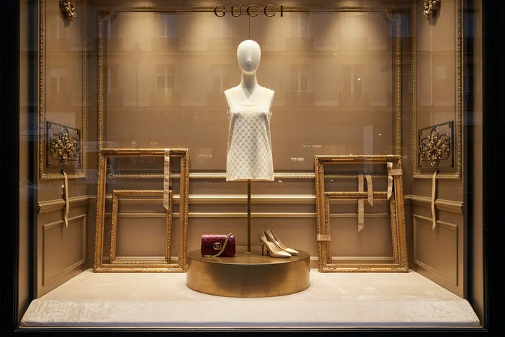 Beige tank top with Gucci logo pattern on a beige background