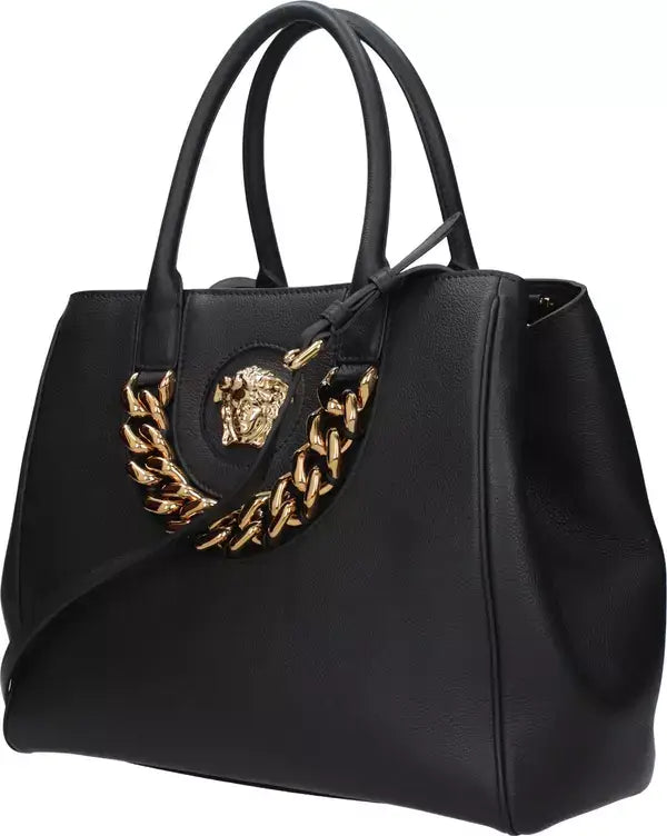 Black handbag with gold emblem on a white background
