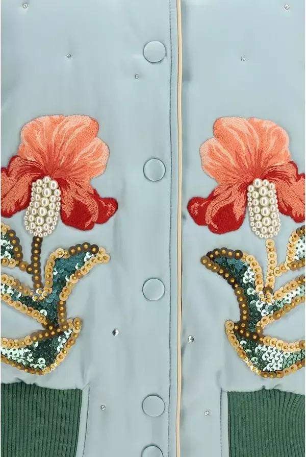 Light blue jacket with floral embroidery and sequins on a light gray background
