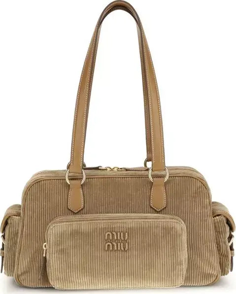 Beige handbag with visible brand logo on a white background