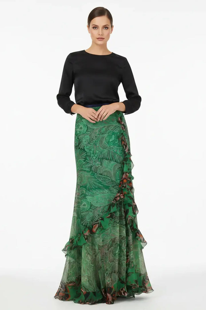 Green floral patterned skirt with ruffled layers on a white background