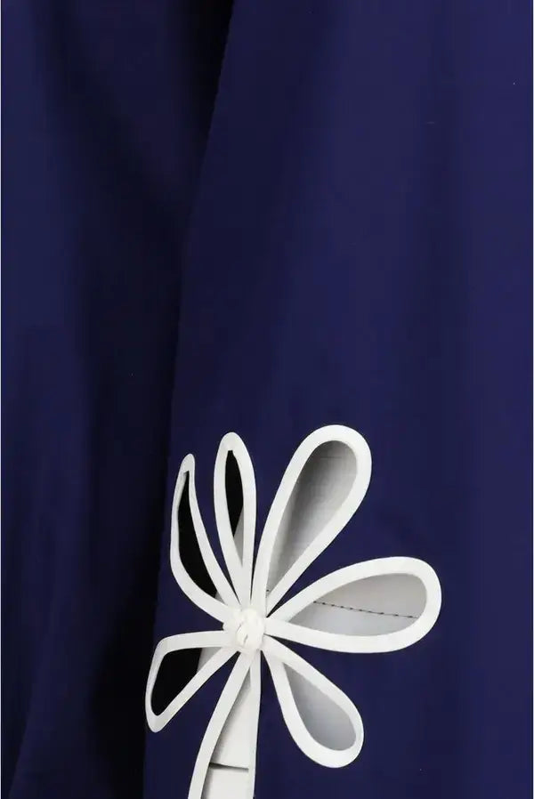 White flower design on a navy blue background
