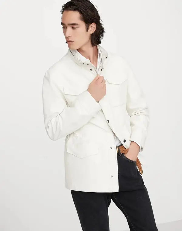 Man wearing a white jacket against a plain background