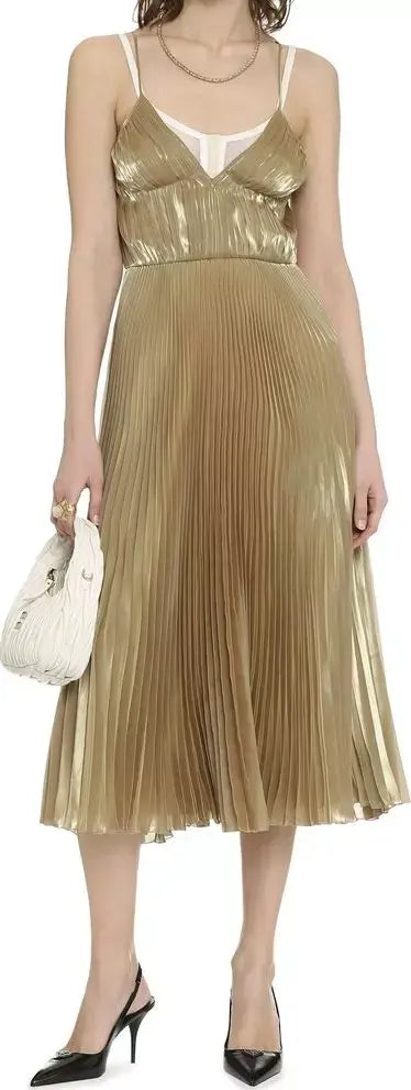 Model in PRADA gold dress