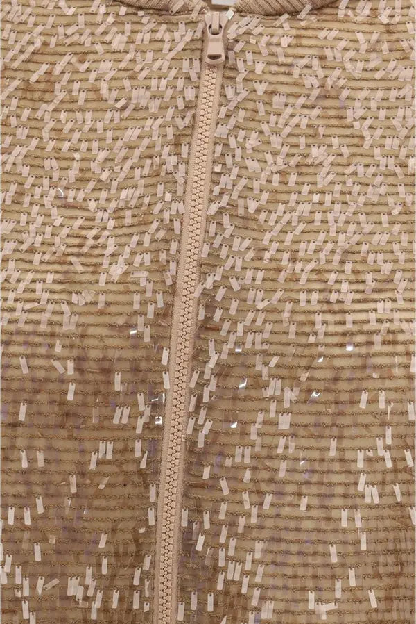 Close-up of a camouflage-patterned fabric with a zipper running vertically.