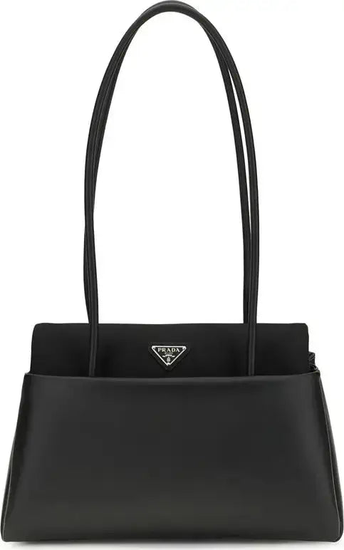 Black handbag with Prada logo on a white background
